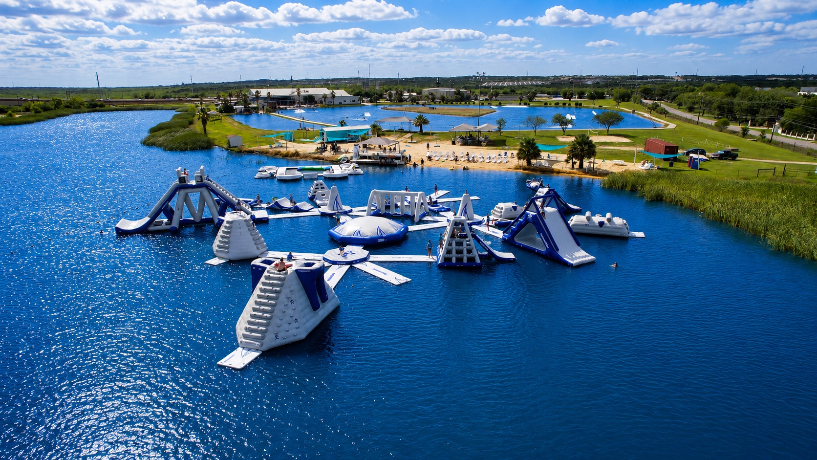 Stoke Factory inflatable aqua park splashing in the Texas sun